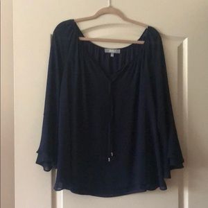Navy blouse with flares sleeves.